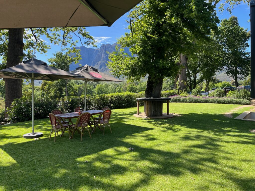 Banhoek Chilli Oil Lawn with shaded table